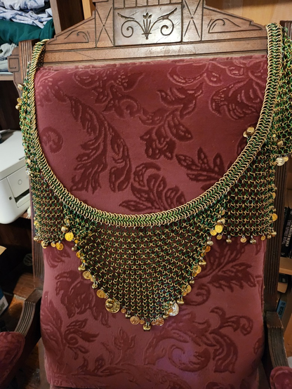 Dance belt as described in post hanging over an antique rocking chair for display.