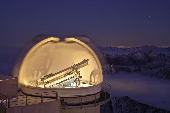 2011 November 25

A Glimpse of CLIMSO
 * Image Credit & Copyright: Alain Sallez (picdumidi.org)

Explanation:
A tantalizing glimpse inside this dome was captured after sunset at the mountain top Pic Du Midi Observatory in the French Pyrenees. But while most are just beginning their work at sunset, this observatory's day was done. The instrument looming within is CLIMSO (for Christian Latouche IMageur Solaire), dedicated to exploring dynamic phenomena across the surface and atmosphere of the Sun. To image the solar atmosphere or corona, CLIMSO uses coronagraphs. Developed by French astronomer Bernard Lyot in the 1930s, coronagraphs block light from the center of the telescope beam to create an artificial solar eclipse and allow a continuous view of the solar corona. In this surreal twilight scene above a sea of clouds, the dome's interior was revealed by the single, long exposure as the open slit rotated across the field of view. 

Authors & editors: Robert Nemiroff (MTU) & Jerry Bonnell (UMCP)
NASA Official: Phillip Newman Specific rights apply.
NASA Web Privacy Policy and Important Notices
A service of: ASD at NASA / GSFC
& Michigan Tech. U.