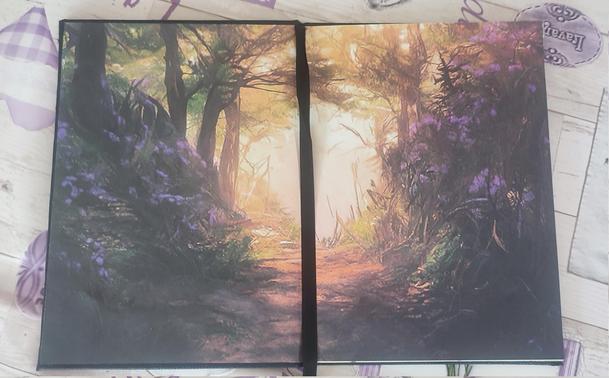 Endpapers with a fantasy themed print. It contains a fantasy forest, with three and flowers.