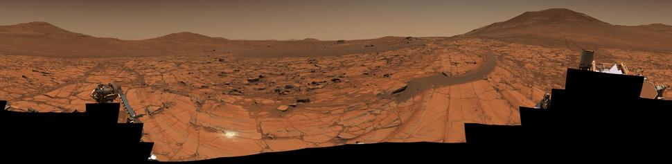 A red-toned mosaic capturing a Martian landscape.