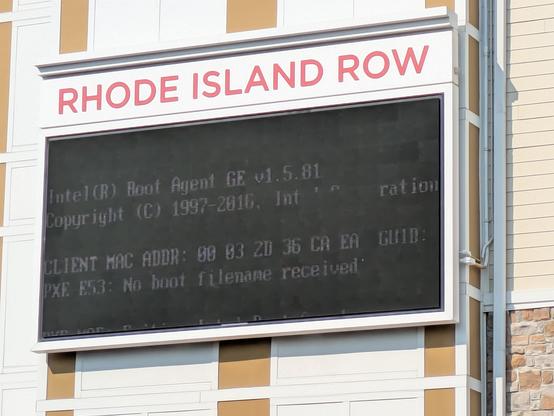 A sign for Rhode Island Row in D.C. that is clearly experiencing technical difficulties. (Looks like maybe a boot screen?)