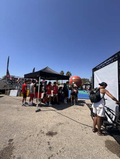 Basketball players on a popup court by the beach in Barcelona