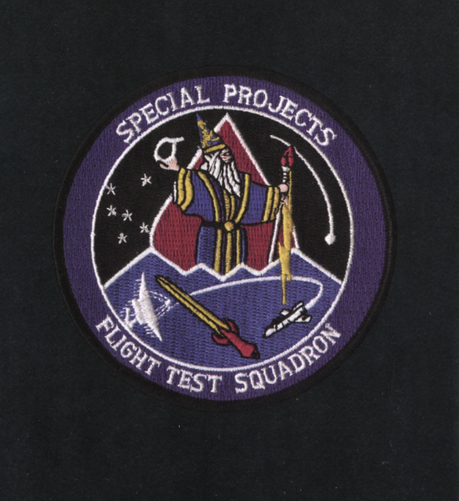 special projects flight test squadron insignia with a strange wizard on it.