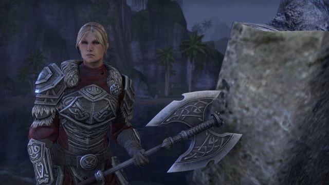 Screenshot of Lyris Titanborn from Elder Scrolls Online. A stern and tall Nord woman in carved plate mail and carrying a giant axe.