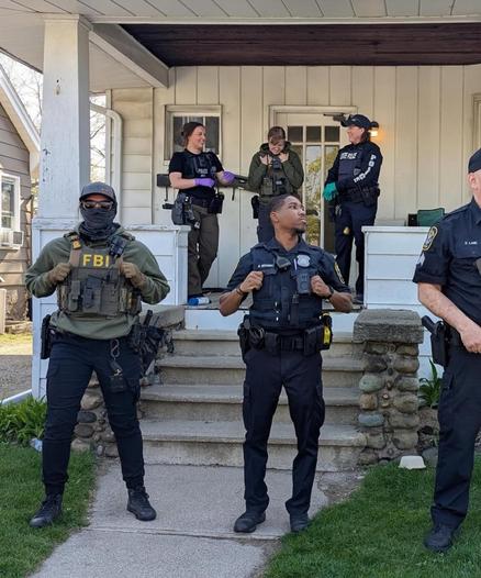 FBI agents and police outside a home in Michigan (Photo via Instagram)