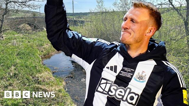 Footballer Dan Burn with his arm raised, and who is wearing the black and white Newcastle kit, is superimposed on to a photo of a small river on the Big Dan Burn Walk.