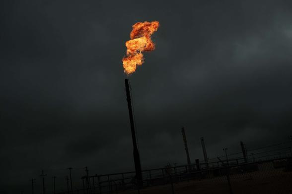 Flared natural gas is burned off at Apache Corporations operations at the Deadwood natural gas plant in the Permian Basin on February 5, 2015, in Garden City, Texas.