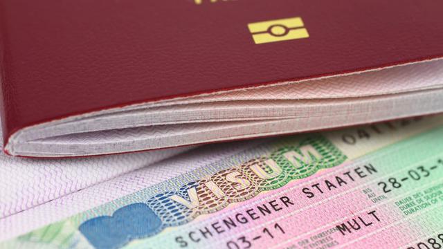 A passport and a Schengen Visa. | iStock A passport and a Schengen Visa. | iStock