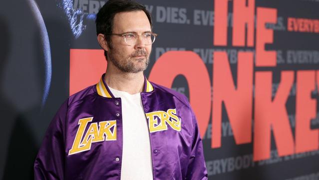 Osgood Perkins attends the Los Angeles Premiere Of Neon's "The Monkey" at Immanuel Presbyterian Church wearing Lakers jacket.