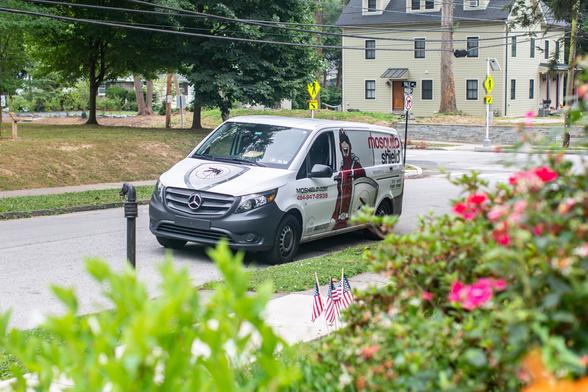 White van that has Mosquito Shield written on the side. 