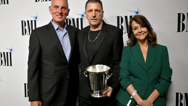 BEVERLY HILLS, CALIFORNIA - MAY 14: (L-R) Mike O'Neill, President & CEO, BMI, Atticus Ross and Tracy McKnight, VP, Creative, Film, TV & Visual Media, BMI attend the 2025 BMI Film, TV & Visual Media Awards at Beverly Wilshire, A Four Seasons Hotel on May 14, 2025 in Beverly Hills, California. (Photo by Lester Cohen/Getty Images for BMI) BEVERLY HILLS, CALIFORNIA - MAY 14: (L-R) Mike O'Neill, President & CEO, BMI, Atticus Ross and Tracy McKnight, VP, Creative, Film, TV & Visual Media, BMI attend the 2025 BMI Film, TV & Visual Media Awards at Beverly Wilshire, A Four Seasons Hotel on May 14, 2025 in Beverly Hills, California. (Photo by Lester Cohen/Getty Images for BMI)
