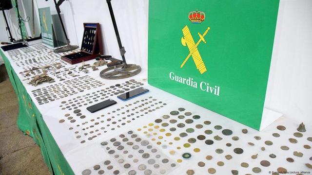 Hundreds of coins recovered by the Spanish Guardia Civil on display