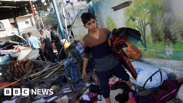 A boy in the rubble after airstrike