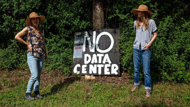 sisters and protest sign
