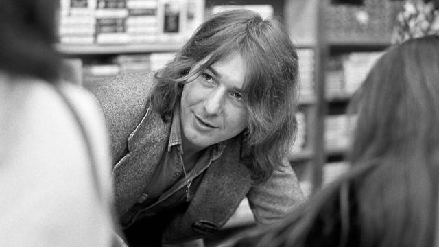 ATLANTA - MARCH 31:  Bad Company guitarist Mick Ralphs signs autographs at a Bad Company instore appearance at Peaches Records on March 31, 1976  in Atlanta, Georgia. (Photo by Tom Hill/Getty Images)