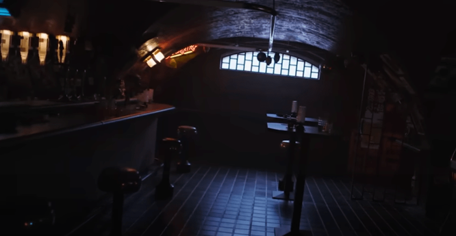 A dimly lit bar in the teaser for Apple TV Plus’ Neuromancer A dimly lit bar in the teaser for Apple TV Plus’ Neuromancer