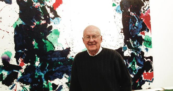 Frederick M. Nicholas as Special Administrator of the Saint Francis Estate in 2003 smiling in front of a painting.