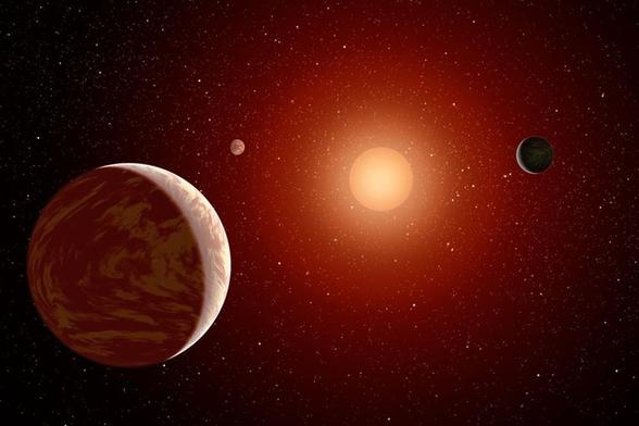 In this artist's illustration, several small exoplanets orbit an M-dwarf (red dwarf) star. New research suggests that these low-mass stars often host Earth-like exoplanets. Image Credit: NASA/JPL-Caltech/MSSS.