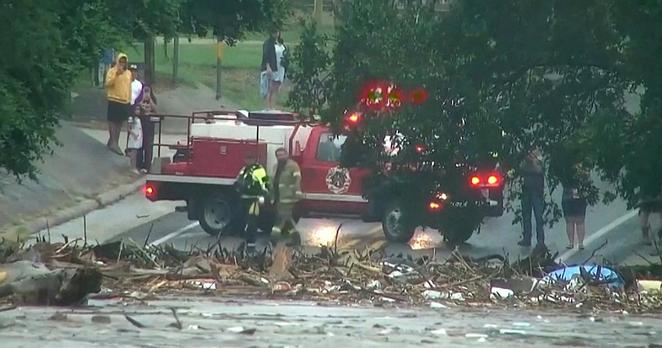 First responders survey the rising flood waters of the Guadalupe River after flash flooding in Kerr County on July 4, 2025 in a still image from video.