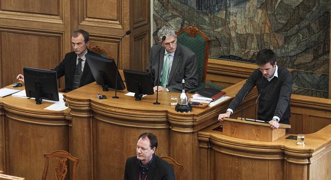 Politicians speaking in the Danish parliament.