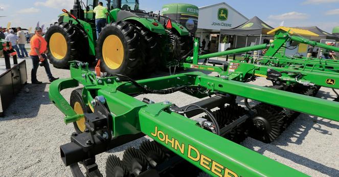 FILE - In this Sept. 10, 2019, file photo a John Deere tractor is on display at the Husker Harvest Days farm show in Grand Island, Neb. More than 10,000 Deere &amp; Co. workers appear ready to go on strike if negotiators can't deliver a new agreement by the end of Wednesday, Oct. 13, 2021. (AP Photo/Nati Harnik, File)