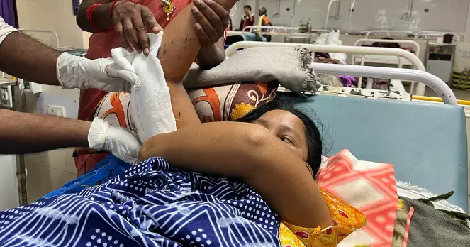 Adivasi woman, at a government hospital in Chhattisgarh after she stepped on an IED planted due to India anti-Naxalite or Maoist drive