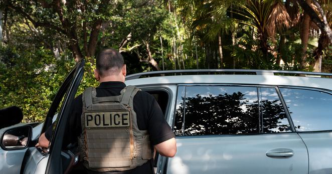 Members of ICE arresting a man from Mexico in Miami Beach, Fla., in May. 