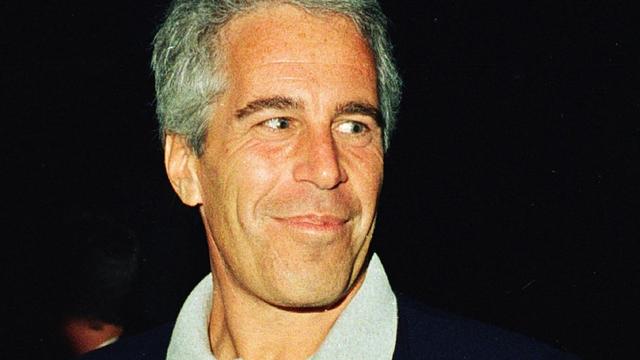 (L-R) Ghislaine Maxwell, Jeffrey Epstein, and musician Michael Bolton pose for a portrait during a party at the Mar-a-Lago club, Palm Beach, Florida, February 12, 2000. (Photo by Davidoff Studios/Getty Images)