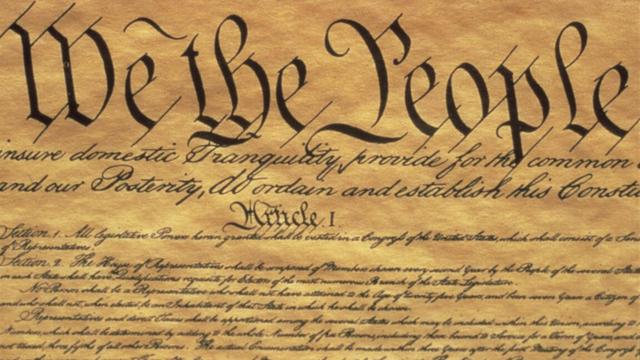 A picture of the opening passage of the US Constitution, beginning "We the people"