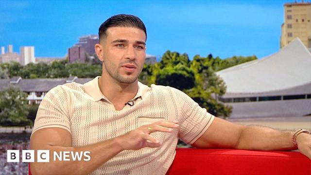 Tommy Fury wearing a beige polo shirt during an interview in the BBC Breakfast studio