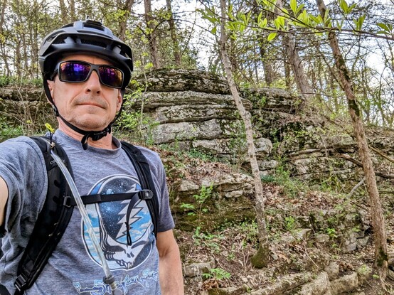 Selfie of the author. An old head in sunglasses wearing a bike helmet 